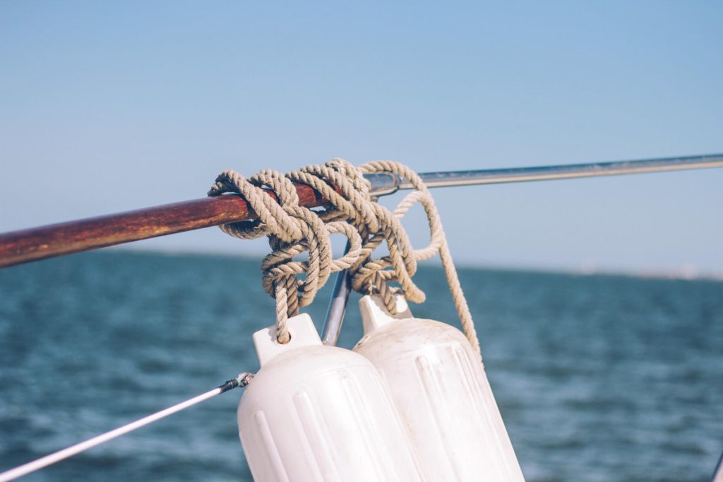 gray rope tied on brown metal rod